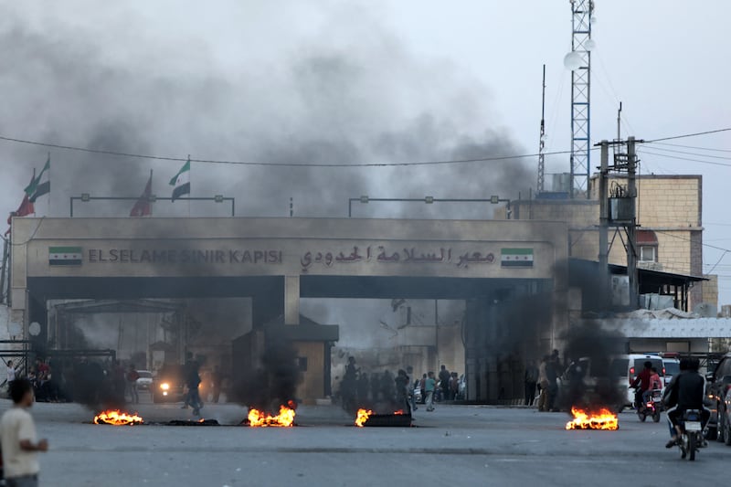 Demonstration by Syrians at the Bab Al Salama border crossing with Turkey in the northern Aleppo governorate on October 17, 2022. AFP