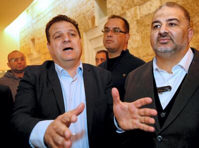 Arab Israeli Knesset Member Ayman Odeh (L) speaks to the press as he stands next to the  head of the Arab Israeli Islamic Party's southern branch, Abbas Mansur, after a hearing at the Israeli Supreme Court in Jerusalem on March 14, 2019, ahead of the upcoming general elections next month. - Arab parties represent the descendants of Palestinians who remained on their land when Israel was created in 1948 and constitute nearly a fifth of the country's population.
The Joint List has separated and now Hadash, the communist party headed by Ayman Odeh, is running with Ahmed Tibi's Taal. Nationalistic group Balad joined forces with Raam, which represents the southern branch of the Islamic Movement. (Photo by GIL COHEN-MAGEN / AFP)