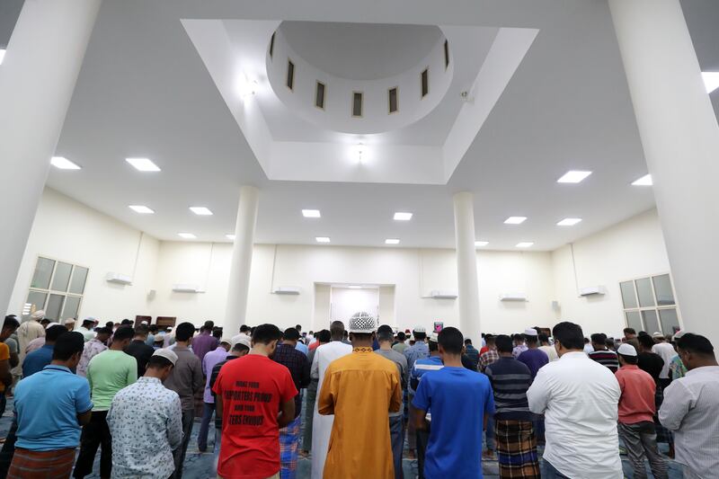 Men pray at the mosque.