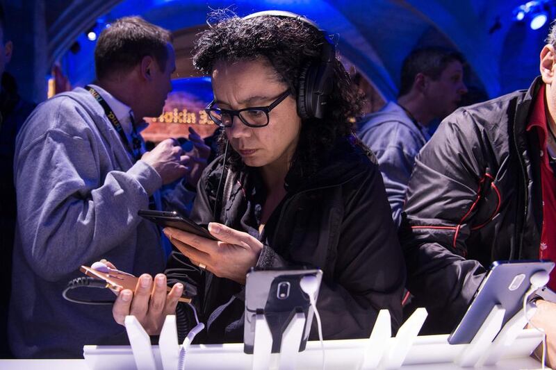 A participant checks Nokia’s new phone Nokia 6 after its presentation on the eve of Mobile World Congress. Josep Lago / AFP