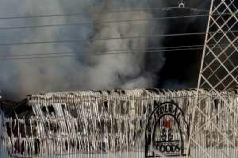 Dubai - June 26, 2009 - Firefighters battled a blaze at Federal Foods in the Al Quoz Industrial Area in Dubai, June 26, 2009. (Photo by Jeff Topping/The National) *** Local Caption ***  JT004-0626-FIRE 7F8Q9158.jpg