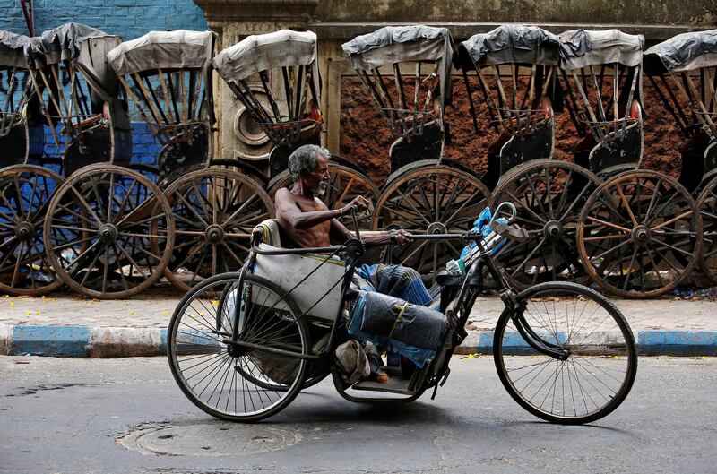 A disabled man on his tricycle in Kolkata, India. Rupak De Chowdhuri / Reuters
