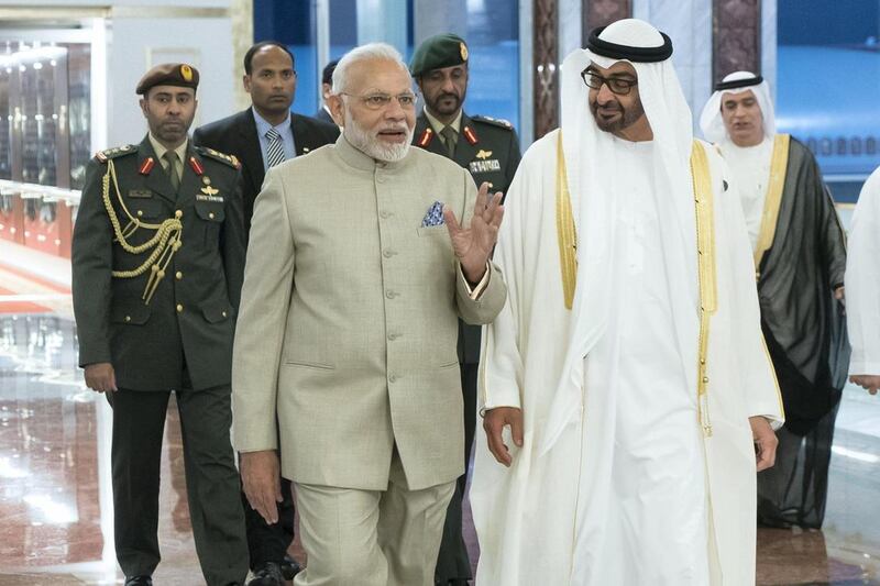 Sheikh Mohammed bin Zayed, Crown Prince of Abu Dhabi Deputy Supreme Commander of the UAE Armed Forces (R), receives Narendra Modi Prime Minister of India (L), at the Presidential Airport. Rashed Al Mansoori / Crown Prince Court - Abu Dhabi