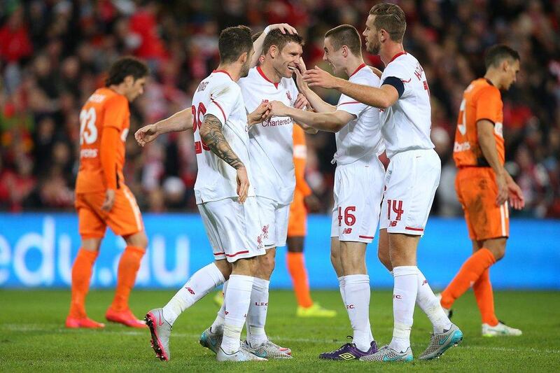 James Milner of Liverpool celebrates scoring the 2-1 winning goal with teammates on Friday against Brisbane Roar in an international friendly in Australia. Chris Hyde / Getty Images