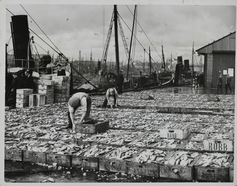 The fish quay at Aberdeen in 1938, with the last of the catches landed at the close of the Scottish herring season. Getty Images