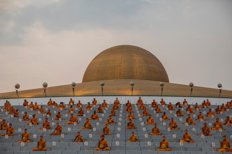 Monks take part in a chanting exercise at Wat Dhammakaya temple. Getty