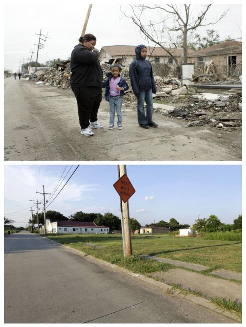 Valerie Thomas, left, and her nieces Shante Fletcher, 6, and Sarine Fletcher, 11, right, looking at the destruction of Valerie’s brother’s home in the Lower Ninth Ward of New Orleans after returning to it for the first time since Hurricane Katrina.