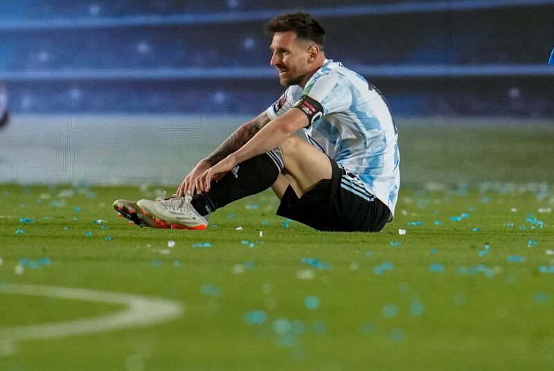 Argentina's Lionel Messi sits on the field during a qualifying soccer match against Brazil for the FIFA World Cup Qatar 2022 at Bicentenario stadium in San Juan, Argentina, Tuesday, Nov.  16, 2021.  (AP Photo / Natacha Pisarenko)