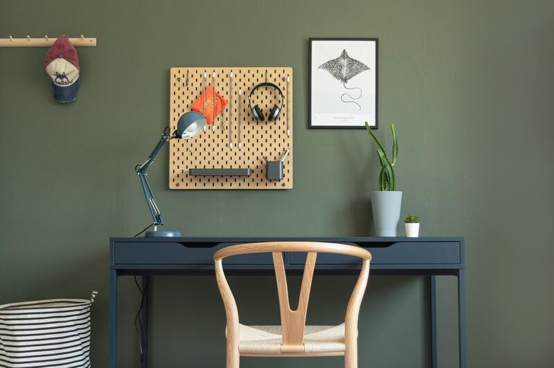 Dubai-based interior designer Kathryn Hawkes recently created a study corner for her son using complementary dark colours and wooden furniture. Marli Smith