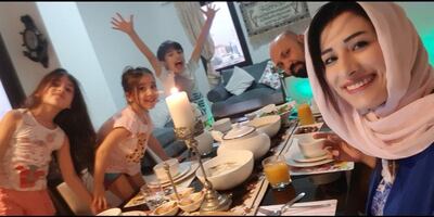 Nesreen Alabbas, an elementary Arabic teacher at American Academy for Girls, sits down for iftar with her family. Courtesy:Nesreen Alabbas
