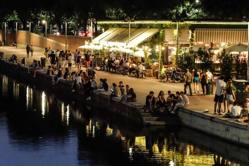 People gather for dinner in Milan, northern Italy. Approximately two-thirds of Italy is classed as low Covid-19 risk white zone. EPA