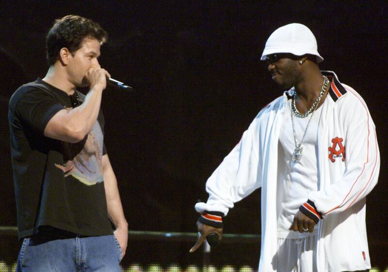 Mark Wahlberg (L) and DMX stand on stage during a live broadcast of the
2001 MTV Video Music Awards in New York September 6, 2001. REUTERS/Gary
Hershorn

JP