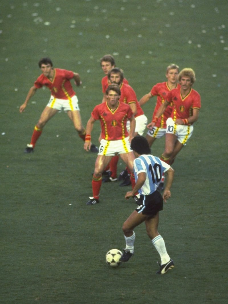1982:  Diego Maradona of Argentina #10 is confronted by a posse of Belgium defenders during the match in the 1982 Wold Cup in Spain. \ Mandatory Credit: Steve Powell /Allsport
