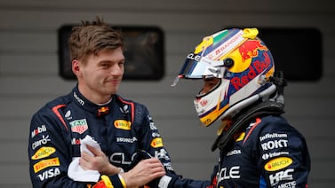 Red Bull's Max Verstappen, left, celebrates after qualifying in pole position along with second-placed Sergio Perez. Reuters