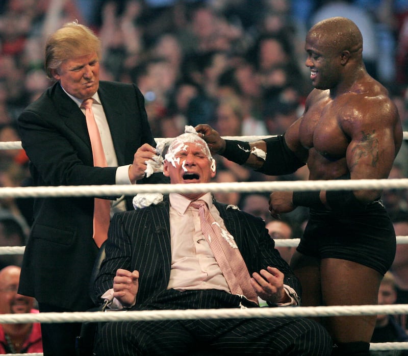 McMahon has a longstanding friendship with Donald Trump, who he often brought into the ring for storyline stunts. Here, McMahon has his head shaved by Trump and Bobby Lashley in 2007 after losing a bet. AFP
