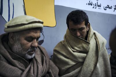 January 15th, 2019 - Kabul, Kabul, Afghanistan: Tooryalai's uncle, Noorallen, and brother, Baryalai, stand outside of the ICU in the Wazir Akbar Khan public hospital in Kabul. Tooryalai was wounded in an explosion while out getting bread for dinner.

The attack on the Green Village, a compound in Kabul that houses foreign workers and NGO's, initially killed 9 and wounded over 120 Afghans who lived in the vicinity. There was also extensive property damage to the surrounding homes and shops. 

Ivan Flores/The National