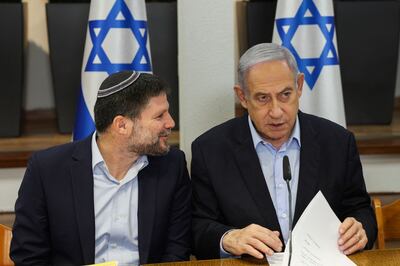 Israeli Finance Minister Bezalel Smotrich, left, a high-profile illegal settler in the occupied West Bank, with Prime Minister Benjamin Netanyahu. AFP