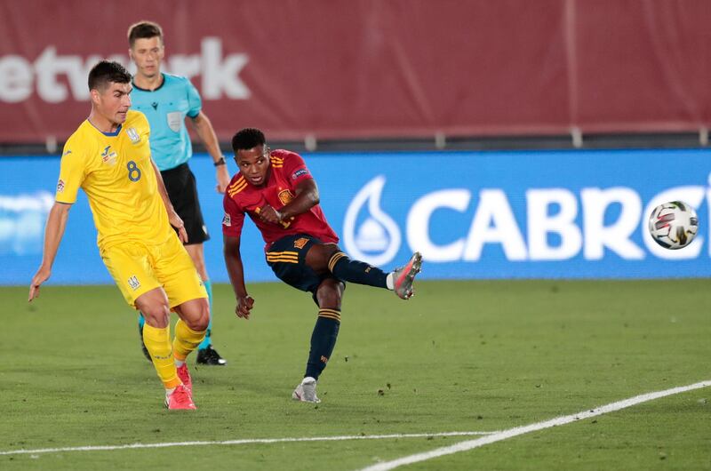 Ansu Fati shoots to score Spain's third goal against Ukraine. AP Photo