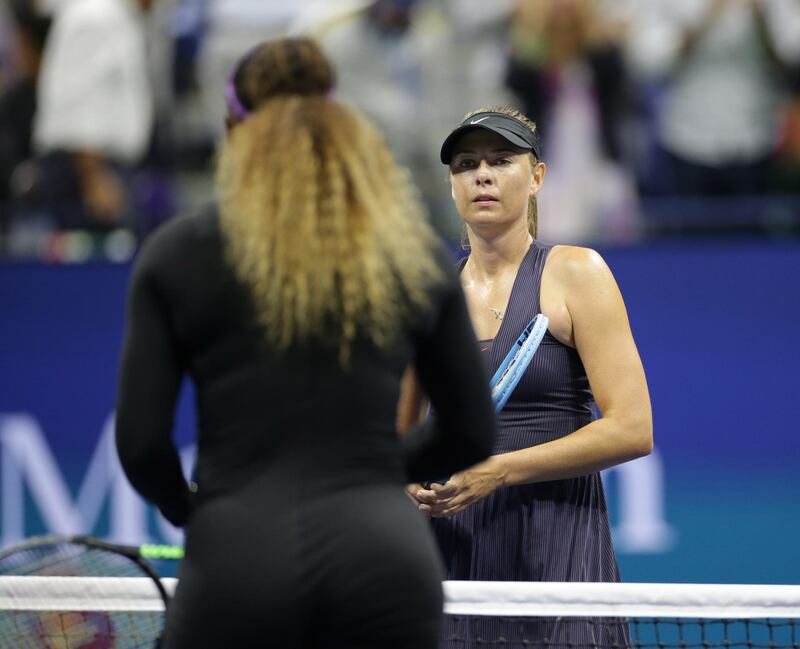 Serena Williams of the United States and Maria Sharapova of Russia meet at the net. Reuters