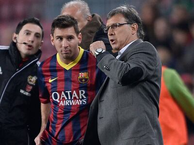 Gerardo Martino and Lionel Messi worked together at Barcelona in the 2013/14 season. AP