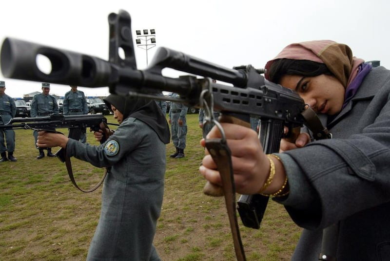 Afghan police officers receive training in Herat on March 2, 2010.  EPA