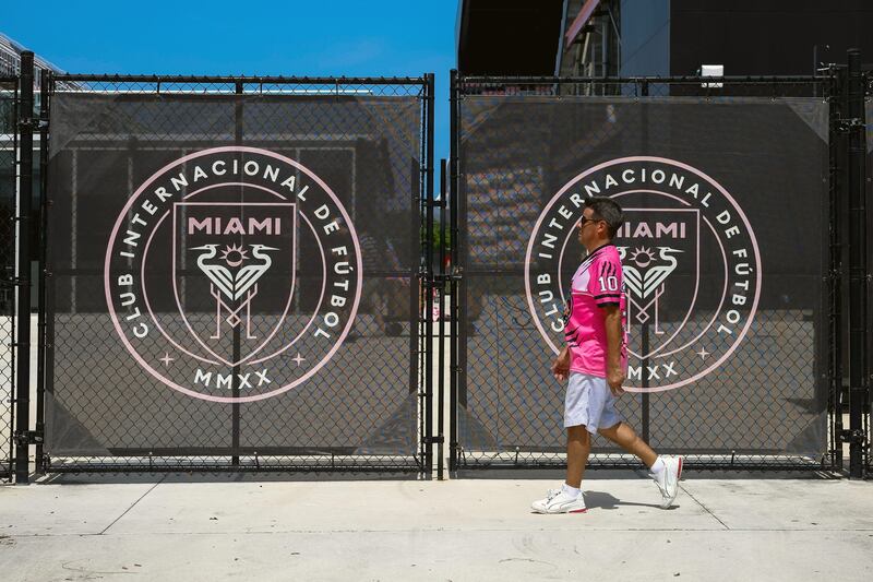 A fan walks outside DRV PNK Stadium in Fort Lauderdale, Florida, ahead of Lionel Messi's arrival. AFP
