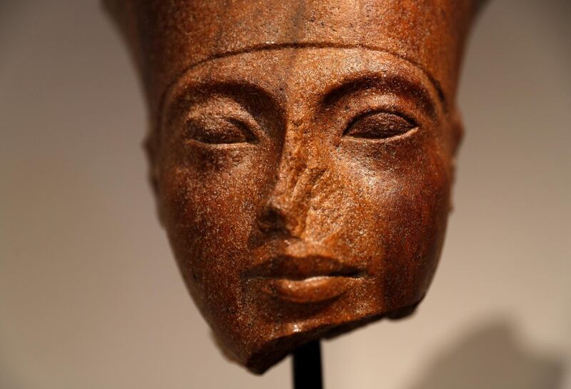 An Egyptian brown quartzite head of the God Amen is seen at Christie's auction house prior to its' sale in London, Britain, July 4, 2019. REUTERS/Peter Nicholls
