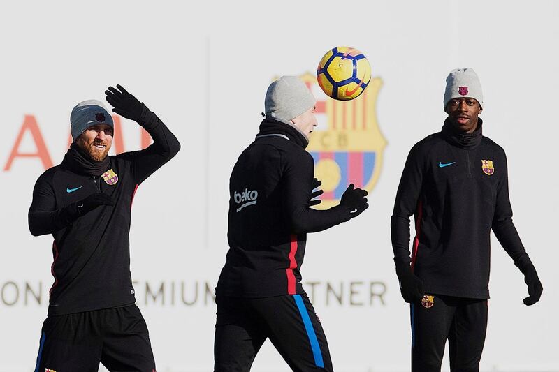 epa06402881 FC Barcelona's players Ousmane Dembele (R), Ivan Rakitic (C) and Lionel Messi take part in a training session of the team at the Joan Gamper sport facilities in Barcelona, northeastern Spain, on 22 December 2017. FC Barcelona will face Real Madrid in a Spanish Primera Division League's match on 23 December.  EPA/Alejandro Garcia