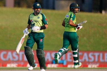 Pakistan's captain Babar Azam (L) and teammate Fakhar Zaman run between the wickets during the fourth Twenty20 international cricket match between South Africa and Pakistan at SuperSport Park in Centurion on April 16, 2021. / AFP / PHILL MAGAKOE