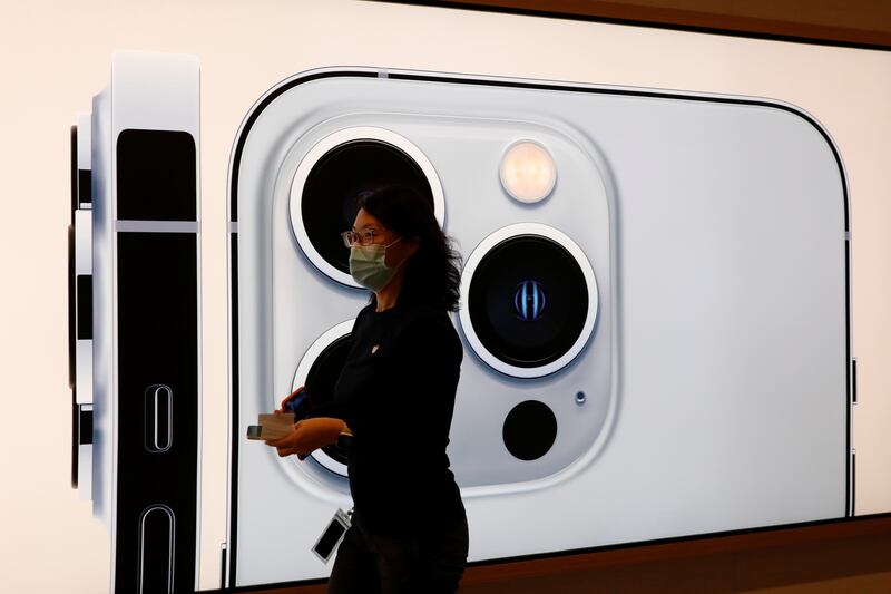 Users of iPhone 12 or later now have the option to use Face ID even with masks on, but Apple warns the full face scan is still the more secure method. Reuters