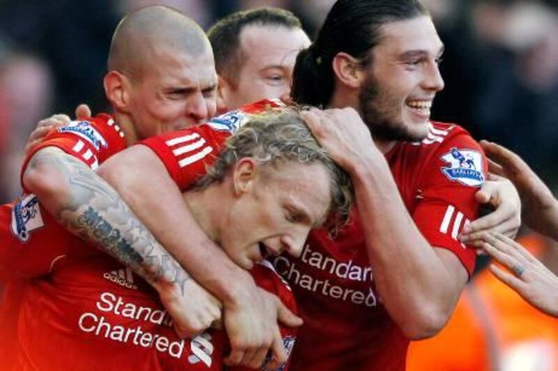 Liverpool's Dirk Kuyt (C) celebrates his goal against Manchester United with Andy Carroll (R) and Martin Skrtel during their English FA Cup fourth round soccer match at Anfield in Liverpool, northern England, January 28, 2012.   REUTERS/Darren Staples   (BRITAIN - Tags: SPORT SOCCER) *** Local Caption ***  DST25_SOCCER-ENGLAN_0128_11.JPG