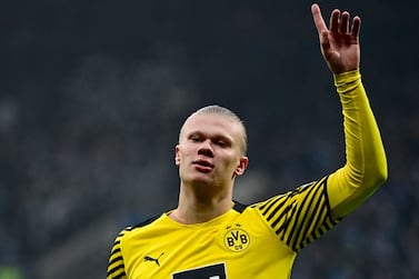 (FILES) In this file photo taken on December 11, 2021 Dortmund's Norwegian forward Erling Braut Haaland gestures during the German first division Bundesliga football match between VfL Bochum and Borussia Dortmund in Bochum, western Germany.  - Manchester City said Tuesday, May 10, they had reached an agreement in principle with Borussia Dortmund to sign striker Erling Haaland.  (Photo by Ina Fassbender  /  AFP)