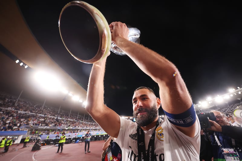 Karim Benzema lifts the Uefa Super Cup after Real Madrid defeated Eintracht Frankfurt at Helsinki Olympic Stadium on August 10, 2022. Getty