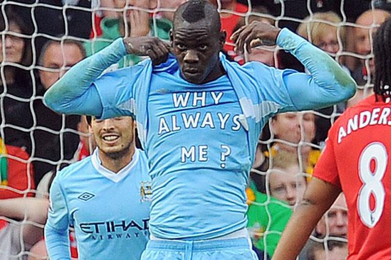 Mario Balotelli, the Man City forward who caused a fire in his house after setting off fireworks, celebrates scoring the first of two, lamenting on the controversy he gets himself into.

Andrew Yates / AFP Photo