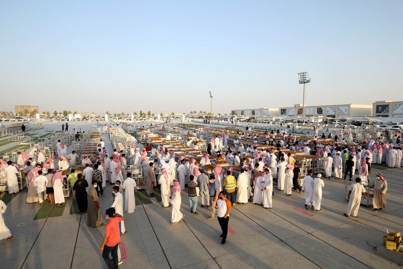 Traders flock to buy dates from Saudi farmers during the Unaizah Season for Dates in Saudi Arabia.
