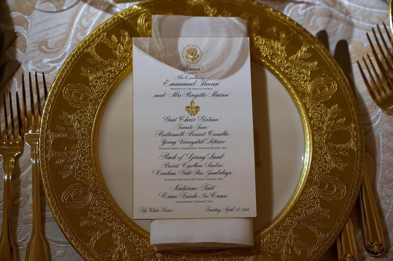 A place setting for the State Dinner for French President Emmanuel Macron is shown in the State Dining Room of the White House in Washington, US, April 23, 2018. Joshua Roberts / Reuters