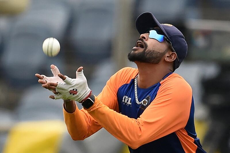 Pacer Mohammed Siraj catches a ball during practice. AFP