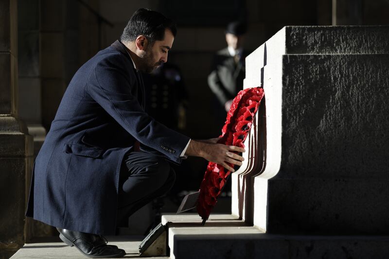 Mr Yousaf lays a wreath during Scotland's Remembrance Sunday Event at Edinburgh City Chambers, in November. Getty Images