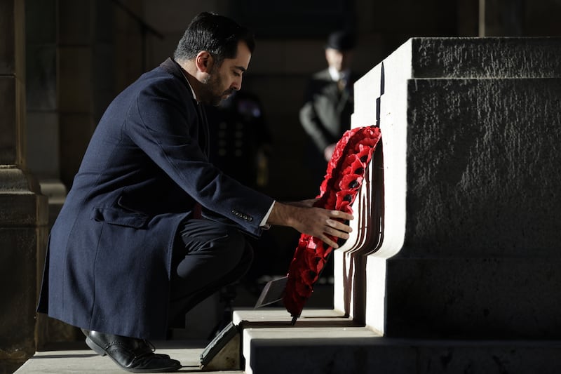 Mr Yousaf lays a wreath during Scotland's Remembrance Sunday Event at Edinburgh City Chambers, in November. Getty Images