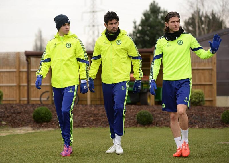 Chelsea’s Oscar, Diego Costa and Filipe Luis arrive for training. Reuters