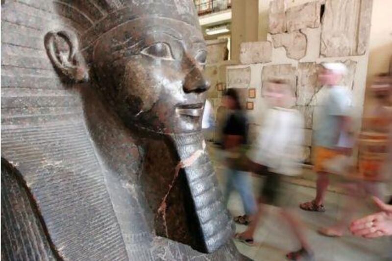 Tourists walk past a statue of Queen Hatshepsut, ancient Egypt's most famous female pharaoh, at the Egyptian Museum in Cairo, 27 June 2007. Egypt announced today the discovery of the long-lost mummy of Queen Hatshepsut, a find billed as the most important since the discovery of King Tutankhamun's tomb.
AFP PHOTO/KHALED DESOUKI