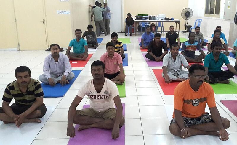 Yoga, meditation, reading and helping to finance children's education are offered to workers in Dubai  by the Sapna project. Courtesy  SmartLife