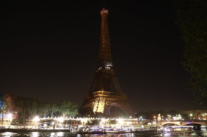 The Eiffel Tower's lights are turned off in Paris as a tribute to the victims of the Morocco earthquake. Getty Images