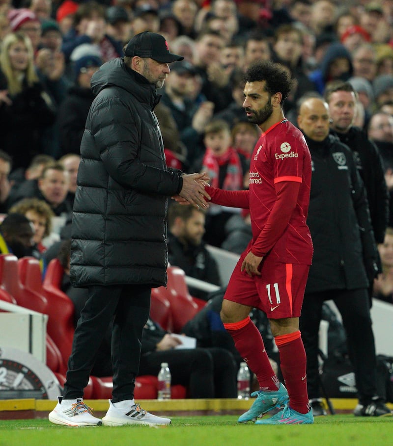 Liverpool's Mohamed Salah walks past manager Jurgen Klopp after being substituted. PA