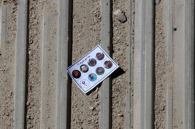 One of the warning leaflets dropped by the Syrian army is seen in the rebel held Tariq al-Bab neighbourhood of Aleppo, Syria September 25, 2016. The leaflet reads (top) "This is your destiny!!!" and (bottom L) " who is next" as it depicts pictures of killed rebel commanders and fighters. REUTERS/Abdalrhman Ismail      TPX IMAGES OF THE DAY