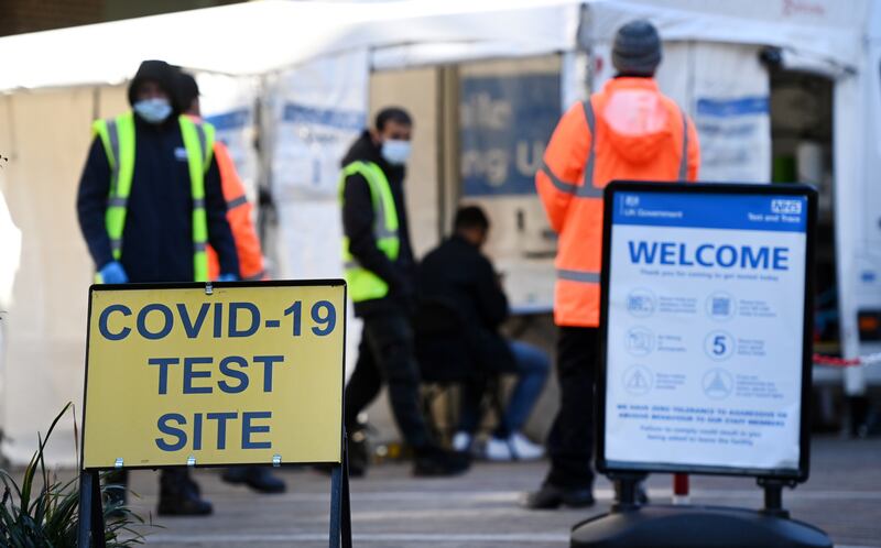 Health workers at a Covid-19 PCR test centre in London. Britain's daily coronavirus case numbers and the seven-day rolling average reached their highest level in three months in October. EPA