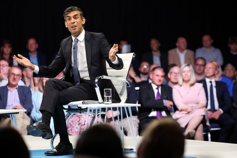 Mr Sunak answers questions as he takes part in the hustings in Leeds. AFP