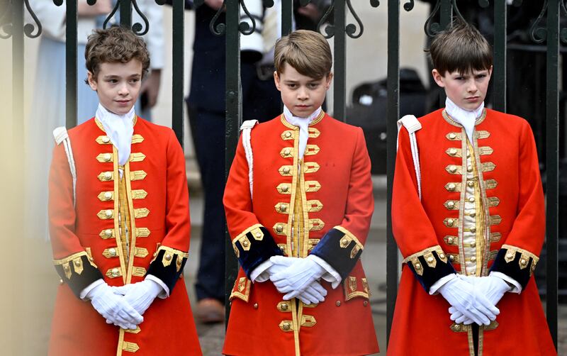 Prince George, centre, ahead of the coronation ceremony. PA