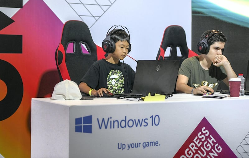 Abu Dhabi, United Arab Emirates - Young kids engrossed in video games at GamesCon, ADNEC. Khushnum Bhandari for The National