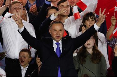 Andrzej Duda gestures as exit polls are announced. Bloomberg